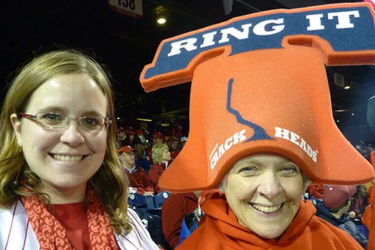 Kerstin Thompson and her mother, Pam Stitely, dressed to show their support for the Phillies on Saturday. (Amy Rosenberg/Staff)