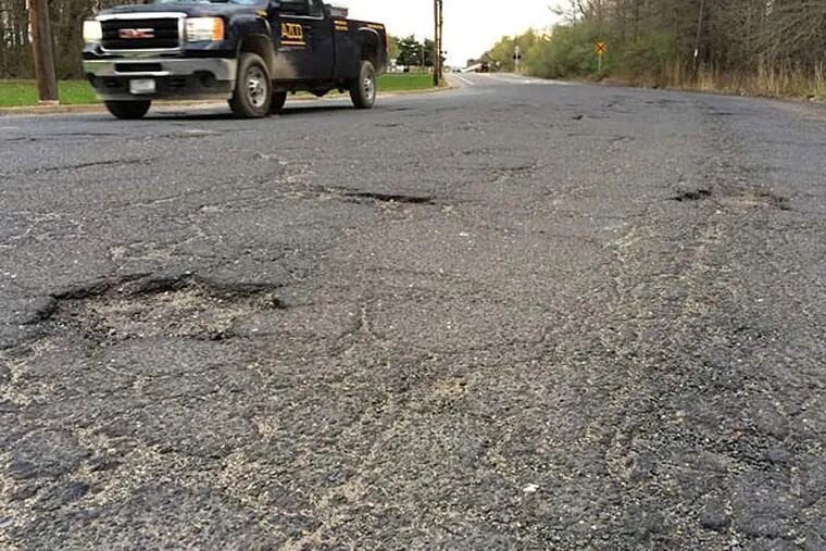 A portion of Paradise Road in West Deptford, where cracks and holes have frustrated drivers. The township plans to ask Gloucester County to take over the road, since it will soon be the main roadway to a new port. (Angelo Fichera/Staff)