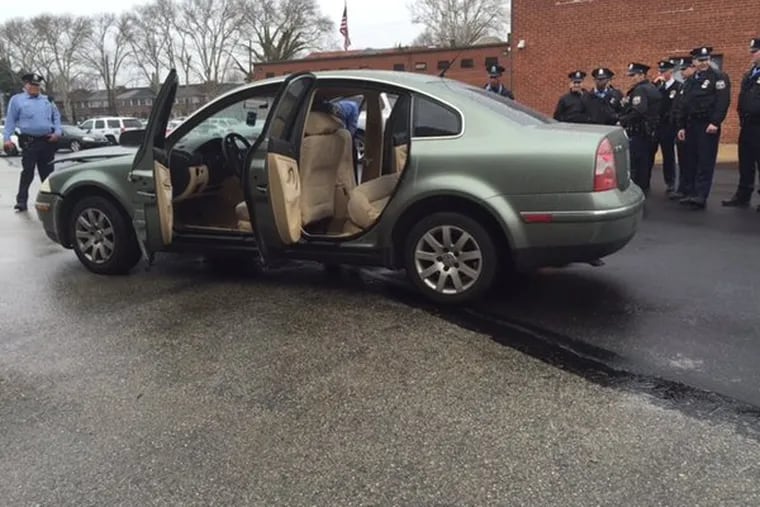 A car with a specially rigged back seat used by alleged dealer to store drugs.