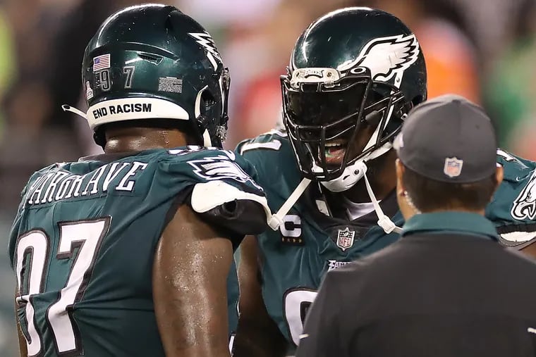 Eagles defensive tackle Fletcher Cox (right) showed his frustration as he talked to defensive tackle Javon Hargrave on the final drive of the game against the Buccaneers.
