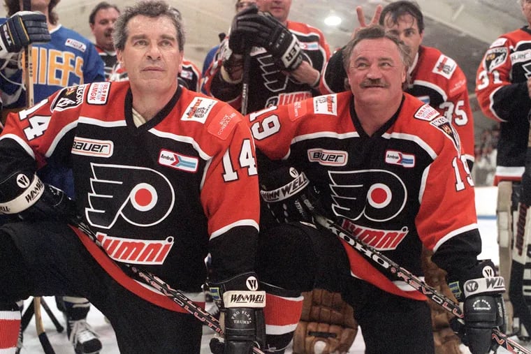 Rick MacLeish (right) with former teammate Joe Watson at a Flyers alumni event in 1997. He scored 349 career goals.