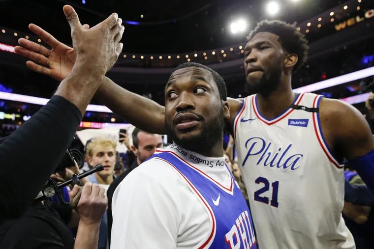Hip-hop artist Meek Mill with Sixers center Joel Embiid after the Sixers beat the Miami Heat in game five of the Eastern Conference quarterfinals on Tuesday, April 24, 2018 in Philadelphia. (Yong Kim/Philadelphia Inquirer/TNS)