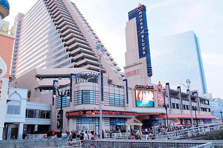 This July 20, 2013 photo shows a slanted hotel tower, left, of the Showboat Casino Hotel in Atlantic City. The casino may close, according to the union chief. (AP Photo/Wayne Parry)