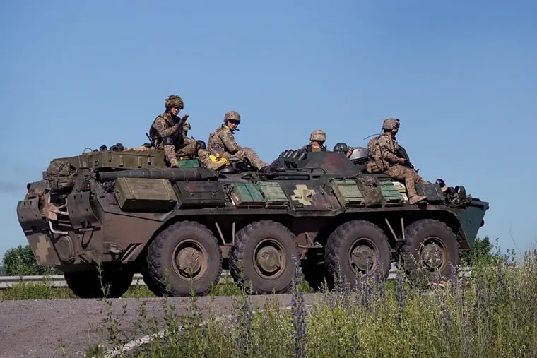Ukrainian troops drive along a road on Wednesday, June 8, 2022, near Sloviansk, Ukraine. (Scott Olson/Getty Images/TNS)