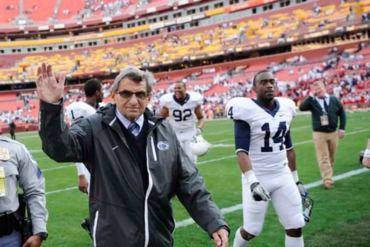 Penn State head coach Joe Paterno waves to the crowd as he leaves the field after beating Indiana 41-24 in 2010. (AP Photo/Nick Wass)