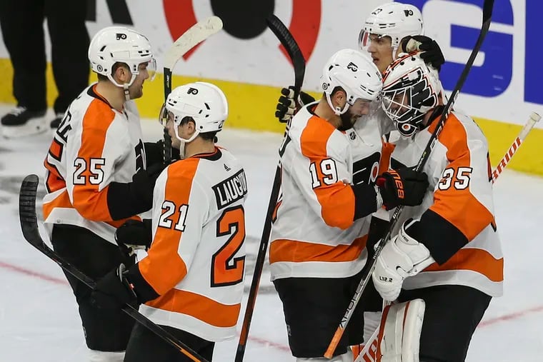 Flyers goalie Martin Jones celebrates their 6-3 win against the Bruins on Oct. 20.