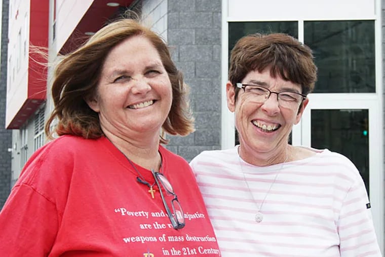 Joan Dawson McConnon, left, and Sister Mary Scullion, right, co-founders of Project Home, gather outside the JBJ Soul Homes in Philadelphia on April 15, 2014. Project Home will celebrate it's 25th anniversary on April 22. ( DAVID MAIALETTI / Staff Photographer )