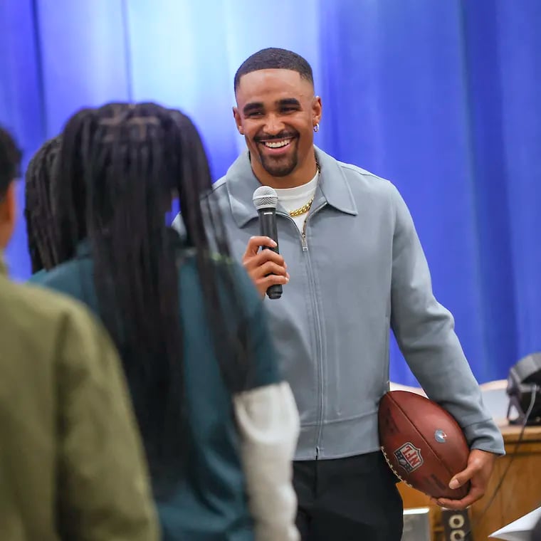 Eagles quarterback Jalen Hurts takes questions from students in the auditorium of Edward Gideon Elementary School in Philadelphia on Friday, April 19, 2024.   Hurts donated $200,000 to the Philadelphia School District to install new air conditioners in 10 schools. .