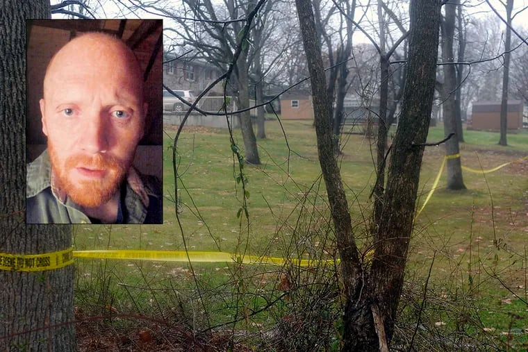 Police tape in the woods in Pennsburg after the body of Bradley W. Stone (pictured) is found Dec. 16, 2014.  (Tom Gralish / Staff Photographer)