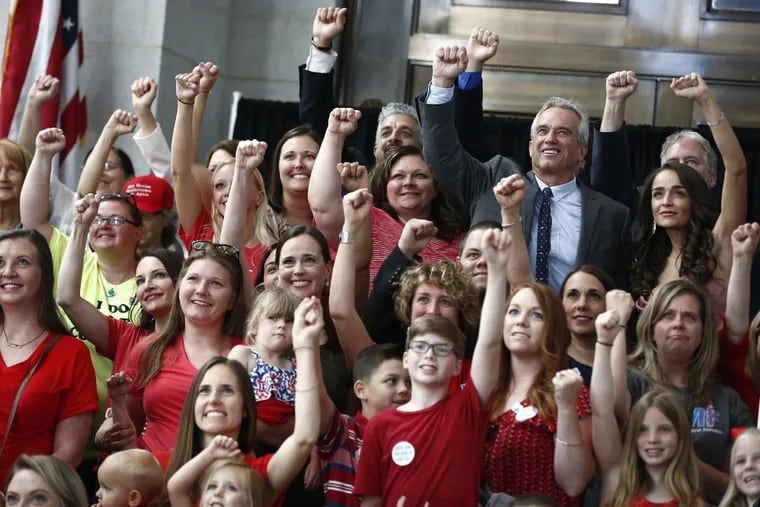 Robert F. Kennedy Jr. poses with audience members after speaking about vaccinations in June at the Ohio Statehouse.