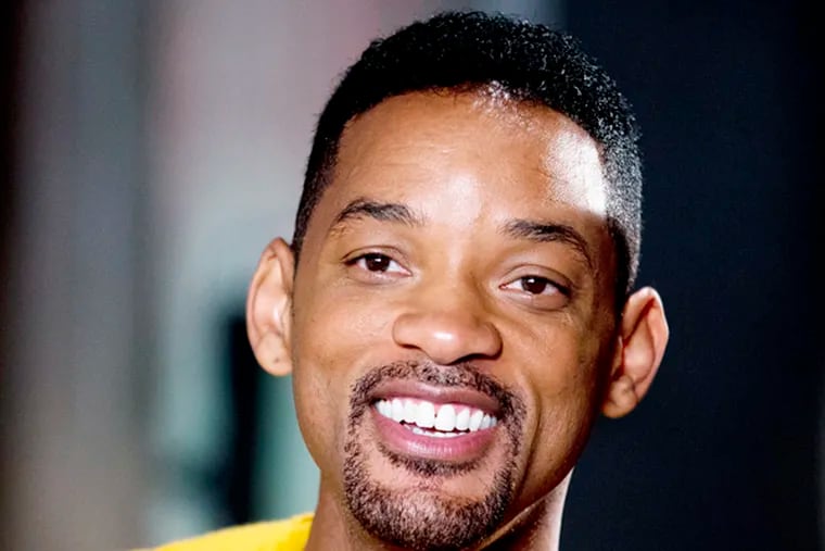 Will Smith smiles during a photo opportunity before the start of a press conference in Buenos Aires, Argentina, Wednesday, Nov. 20, 2013. (AP Photo/Natacha Pisarenko)