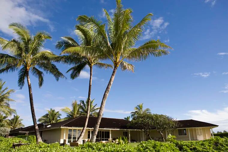 Palm trees sway in the breeze outside the $9 million single-story oceanfront home where President-elect Barack Oama and his family are staying during their vacation in Kailua, Hawaii.