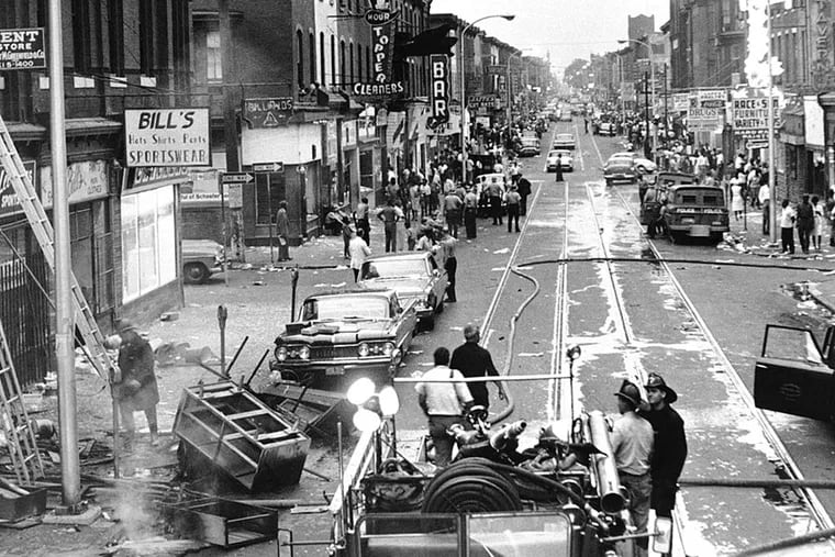 In 1964, a view of Columbia Avenue - now Cecil B. Moore Avenue - looking west from 15th Street shows heavy damage from the rioting and looting. A false rumor that police had beaten a pregnant woman to death helped fuel the anger.
