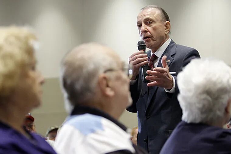 Sen. Arlen Specter addresses the crowd during a town hall meeting on health care in State College this morning. More than 400 attended. Opponents occasionally drowned out the Republican-turned-Democrat.