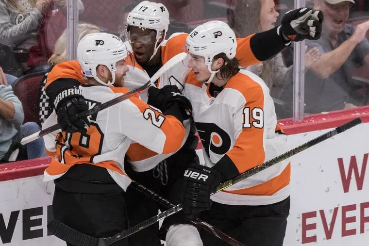 The Flyers' Claude Giroux (28) Wayne Simmonds (17) and Nolan Patrick (19) celebrate Giroux's third-period goal Monday   against the Arizona Coyotes. Giroux had two goals and an assist in the 5-2 Flyers win.