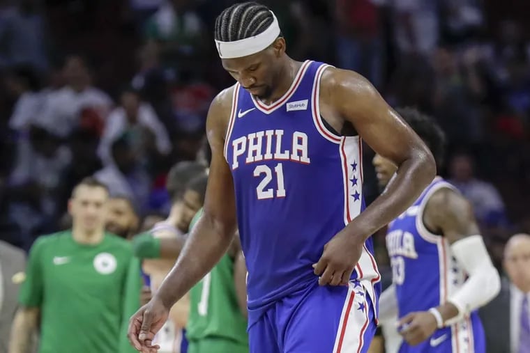 Sixers center Joel Embiid walks off the court after losing to the Boston Celtics 102-92 on Friday at the Wells Fargo Center.