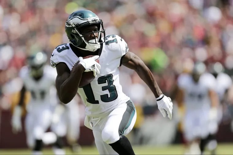 Eagles wide receiver Nelson Agholor heads for a touchdown against the Redskins on Sunday.