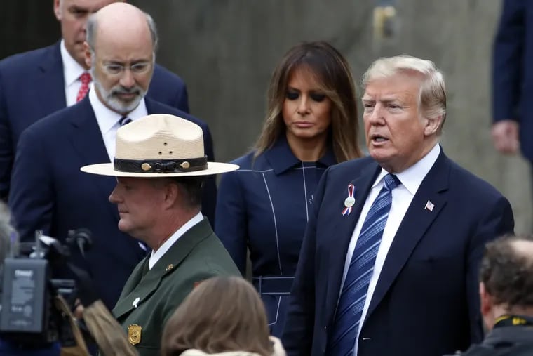 President Donald Trump, right and first lady Melania Trump, second from right, arrive with Pennsylvania Governor Tom Wolf, left rear, at the September 11th Flight 93 Memorial Service in Shanksville, Pa., Tuesday, Sept. 11, 2018.