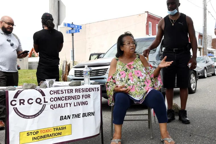 Zulene Mayfield (middle), founder of Chester Residents Concerned For Quality Living, speaks during a community meeting on Thurlow Street in Chester on June 26, 2021.