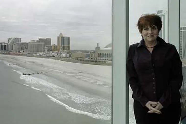 Terry Lemiere, the sales director for One Atlantic, stands in front of a large window of One Atlantic on the fourth floor of the Pier at Caesars. (Akira Suwa / Staff Photographer)