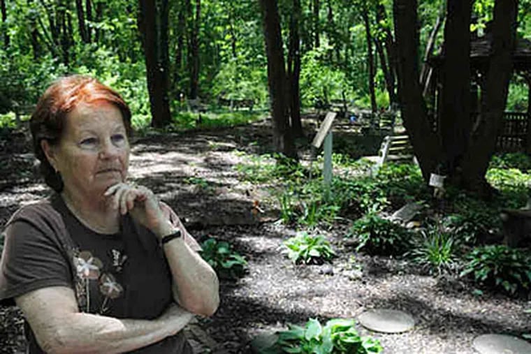 Marilyn Dougherty at the Living Memorial Gardens, where people who've lost loved ones to violence can come to heal. Her son was murdered in 1979. (Sarah J. Glover / Staff)