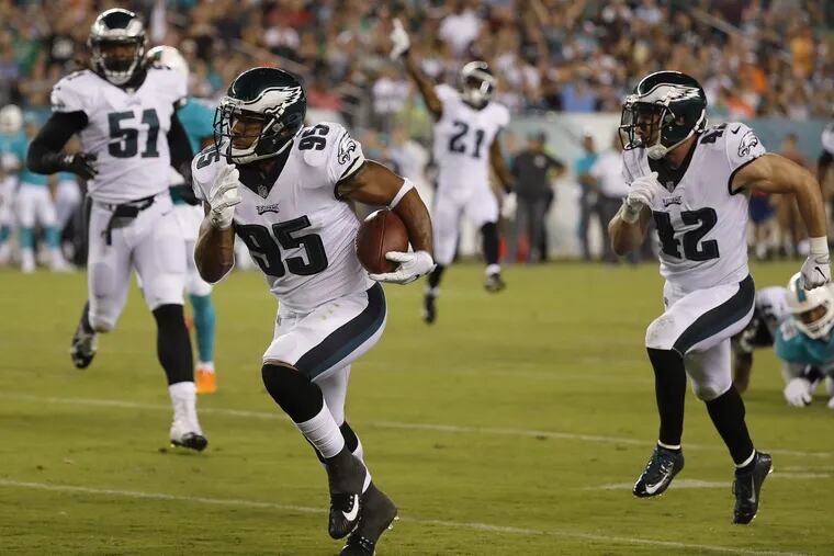 Eagles’ Mychal Kendricks returns an interception for a touchdown in the 2nd quarter as the Eagles play the Miami Dolphins during a preseason game in Philadelphia, PA on Thursday.