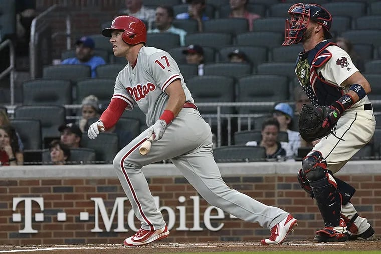 Philadelphia Phillies’ Rhys Hoskins (17) watches his line drive to center field during the first inning of a baseball game against the Atlanta Braves, Saturday, Sept. 23, 2017, in Atlanta. Nick Williams scored on the play.