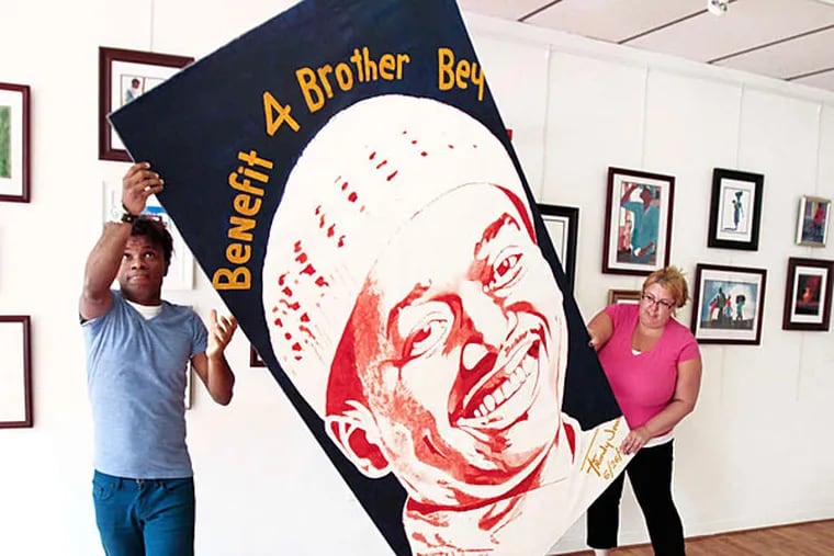Frandy Jean (left) and Gina Yacovelli of Frandy Jean Gallery plan a July 10 benefit for Brother Daoud Bey. Bey helped when Jean moved to the United States from Haiti. (Elizabeth Robertson/Staff)