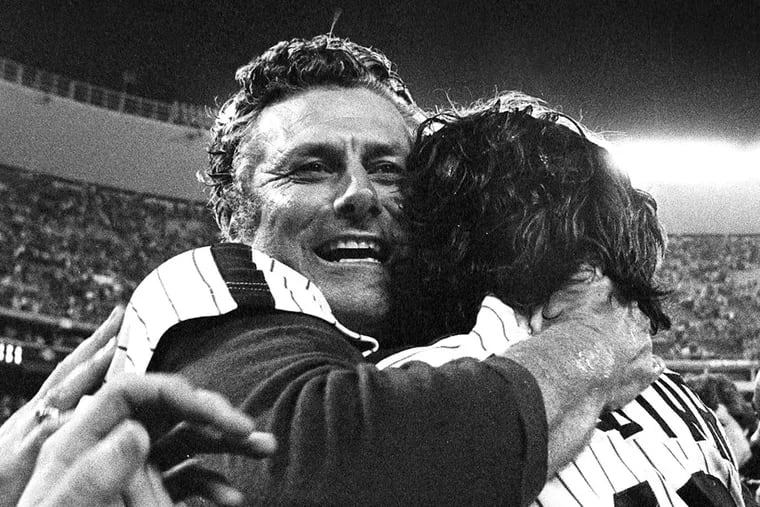 Dallas Green (left) hugged reliever Warren Brusstar after the Phillies won the 1980 World Series.