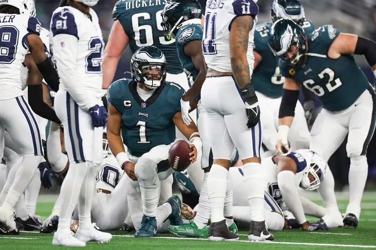 Philadelphia Eagles quarterback Jalen Hurts stands up after a tush push play but a flag brought them back in the second half of a game against the Cowboys at AT&T Stadium in Arlington, Texas on Sunday, Dec. 10, 2023. Eagles lost, 33-13.