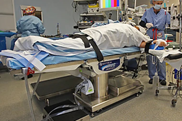 One of the newer, larger operating room tables that are made to take the extra weight the larger patients of Abington hospital might put on it. (Michael Bryant/Inquirer)