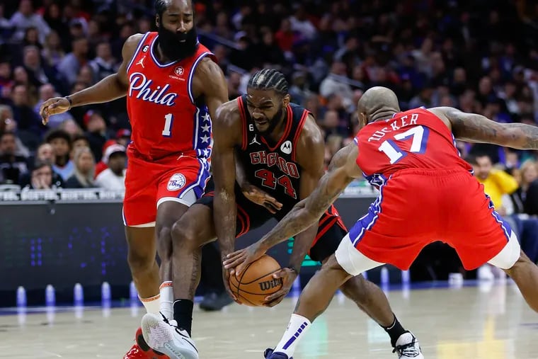 Sixers guard James Harden (1) and forward P.J. Tucker defend Chicago Bulls forward Patrick Williams in the first quarter.
