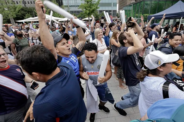 Soccer fans react, during a FIFA World Cup 2026 Host Cities watch party in LOVE Park, when it is revealed that Philadelphia was chosen as a men's World Cup tournament host city for the first time in history on June 16, 2022.