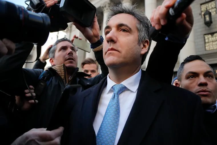 In this Nov. 29, 2018, photo, Michael Cohen walks out of federal court in New York. A pattern of deception by advisers to President Trump, aimed at covering up Russia-related contacts during the 2016 campaign and transition, has unspooled bit by bit in criminal cases from special counsel Robert Mueller.