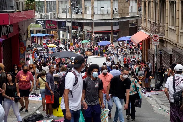 People walk in the commercial center of Sao Paulo, Brazil, on Oct. 18, 2021 amid the COVID-19 pandemic. The remote-work revolution has led some U.S. technology companies to seek new hires in Latin America. (Cris Faga/NurPhoto/Zuma Press/TNS)
