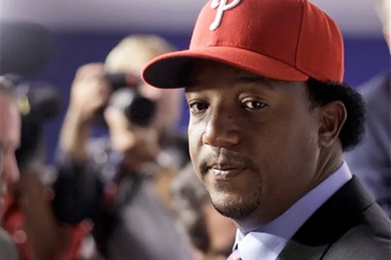 Pedro Martinez looks on during a news conference in Philadelphia after he agreed to a $1 million, one-year contract with the Phillies on Wednesday, July 15, 2009. (AP Photo/Matt Rourke)