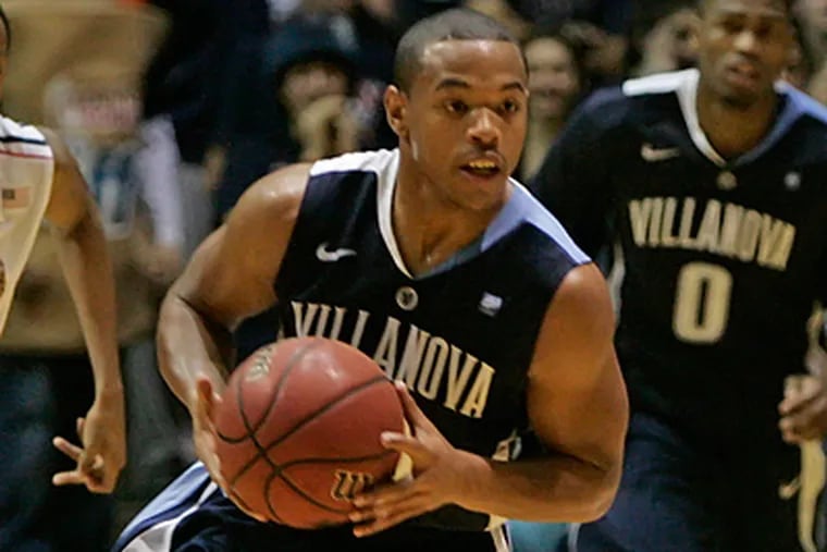Villanova's Corey Fisher steals the ball during the second half of the game. (Michael Bryant / Staff Photographer)