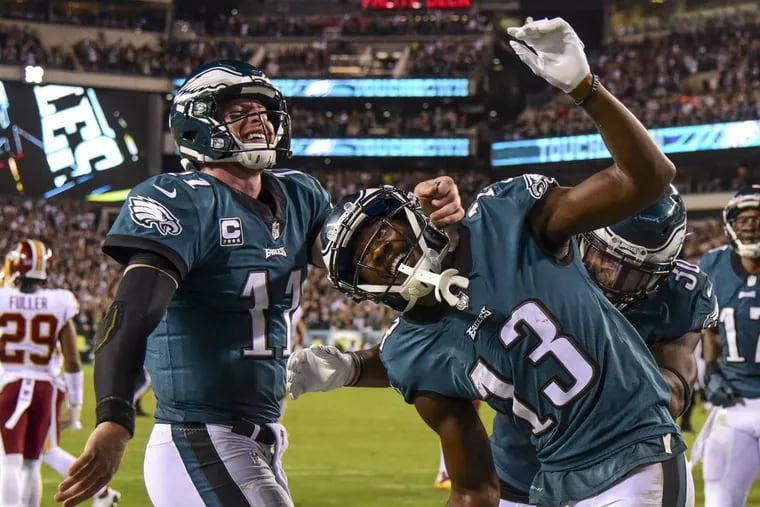 Philadelphia Eagles wide receiver Nelson Agholor and quarterback Carson Wentz celebrte the 10-yard pass and catch touchdown they teamed up on in the 4th quarter of the game against the Washington Redskins at Lincoln Financial Field.