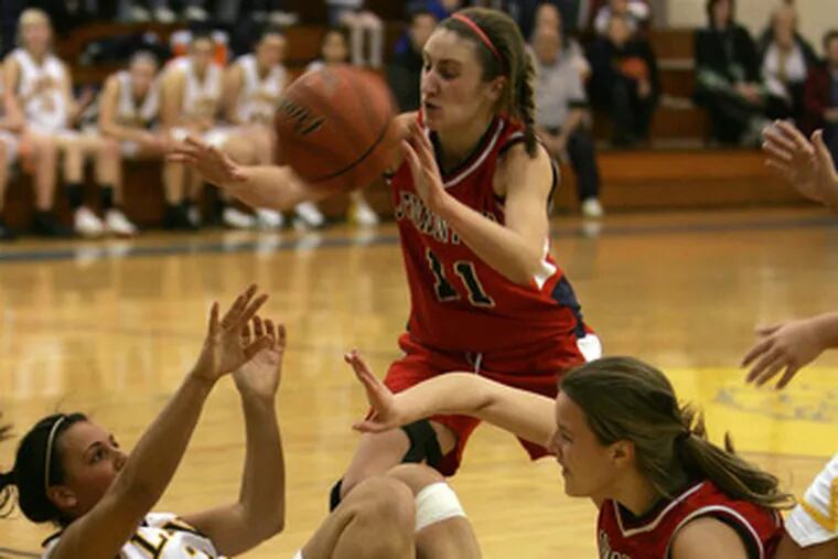Lower Moreland&#0039;s Nicole Cataline (left) scrambles for a loose ball vs. Jenkintown.