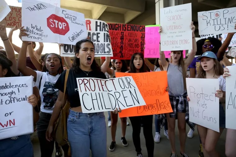 Victoria Mejiar, a sophomore at South Broward High School attends a rally at the Federal Courthouse in Fort Lauderdale, Fla., to demand government action on firearms, on Saturday.