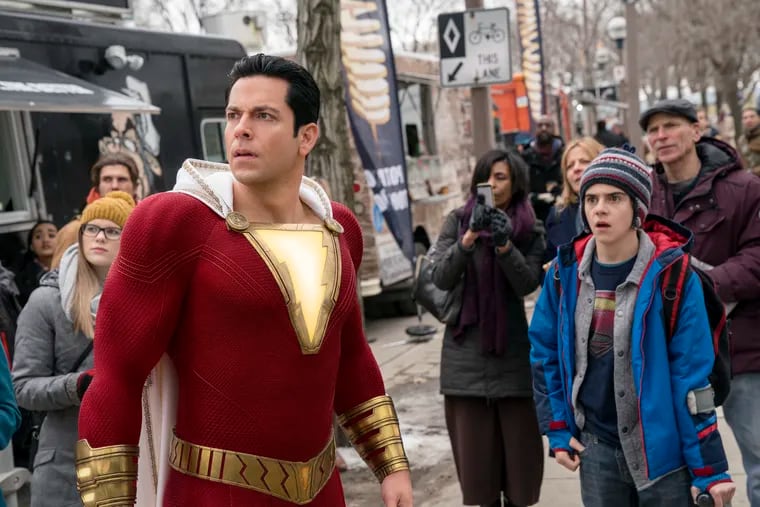 This image released by Warner Bros. shows Zachary Levi, left, and Jack Dylan Grazer in a scene from "Shazam!"