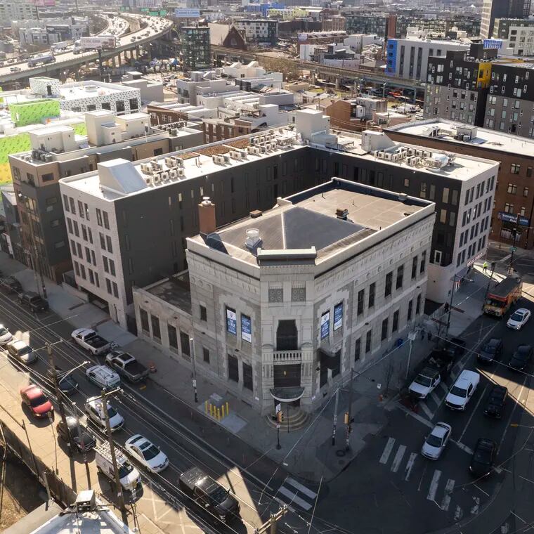 The former Kensington National Bank building at Frankford and Girard Avenues is being turned into a large retail space and apartments by the same developer that built the Avant, the new apartment building that wraps around it.