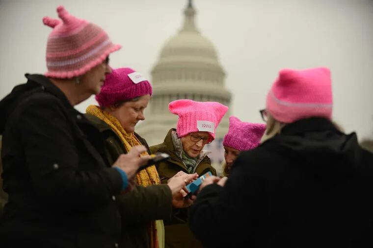 A group of women from Iowa City with pink hats gather near the U.S. Capitol in Washington for the Women&#039;s March last weekend.