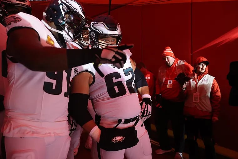 Philadelphia Eagles defensive tackle Fletcher Cox (left) and center Jason Kelce (right) talk as they wait to take the field before the Eagles play the Chiefs at Arrowhead Stadium in Kansas City, Mo. on Monday, Nov. 20, 2023.