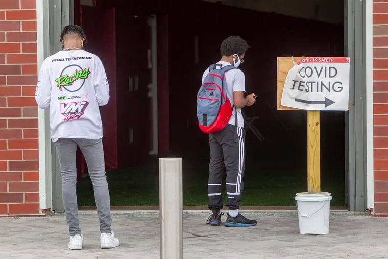 Temple University students wait to gain access to COVID-19 testing at Temple last year. High school and college students are enormous assets in training the next generation of teachers, writes Sharif El-Mekki.