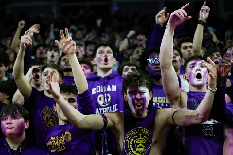 Roman Catholic student section fans cheer against Archbishop Ryan during the Philadelphia Catholic League boys’ basketball championship game at the Palestra on Feb. 26.