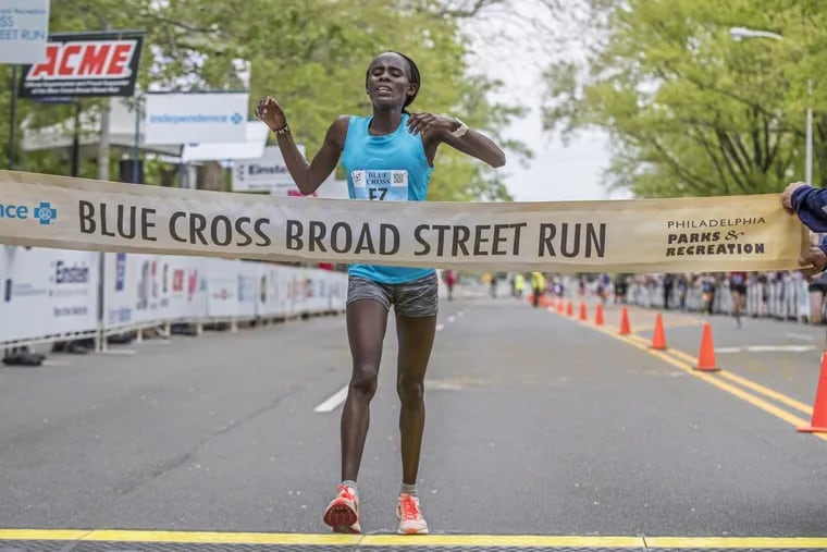 Sophy Jepchirchir crosses the finish line to win the women’s division of the 2018 Blue Cross Broad Street run on Sunday May 6, 2018.
