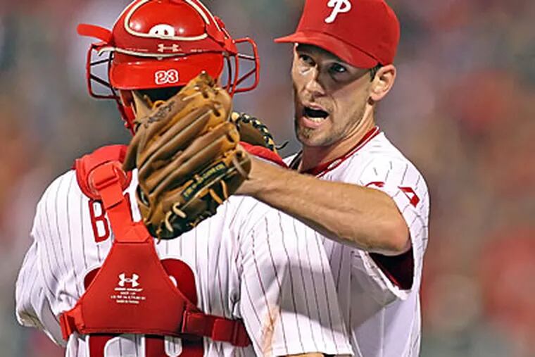 Philadelphia Phillies catcher Paul Bako congratulates pitcher Cliff Lee, who pitched a complete game against the Arizona Diamondbacks at Citizens Bank Park, Wednesday, IN AN 8-1 WIN. (Steven M. Falk/Staff Photographer)