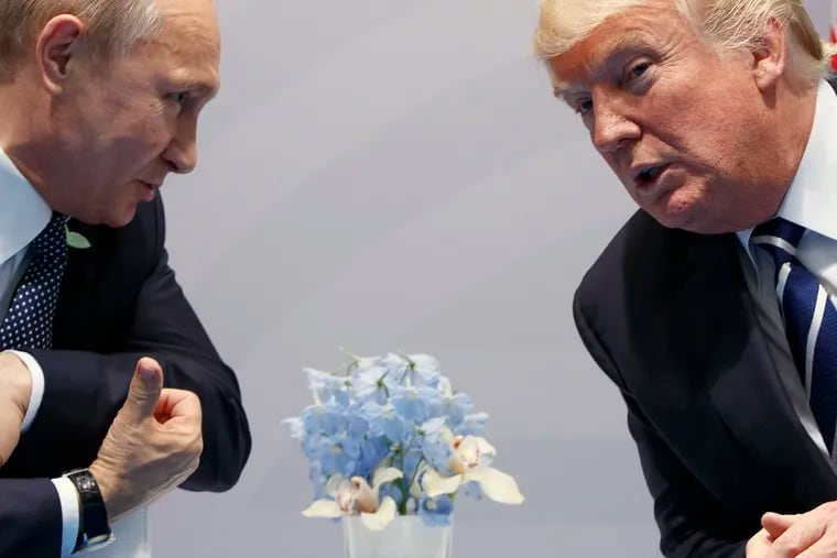 Then-U.S. President Donald Trump, right, meets with Russian President Vladimir Putin at the G20 Summit in Hamburg, Germany, in 2017. While in power, Trump derided the leaders of some friendly nations while praising authoritarians such as Putin, a wanted war criminal.