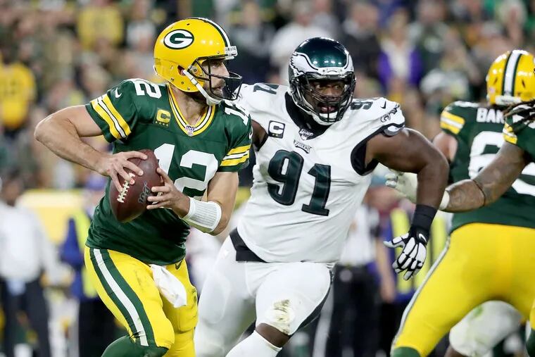 Can Fletcher Cox (91) and the Eagles keep Aaron Rodgers under control? They did last year. They'll have to do it again.